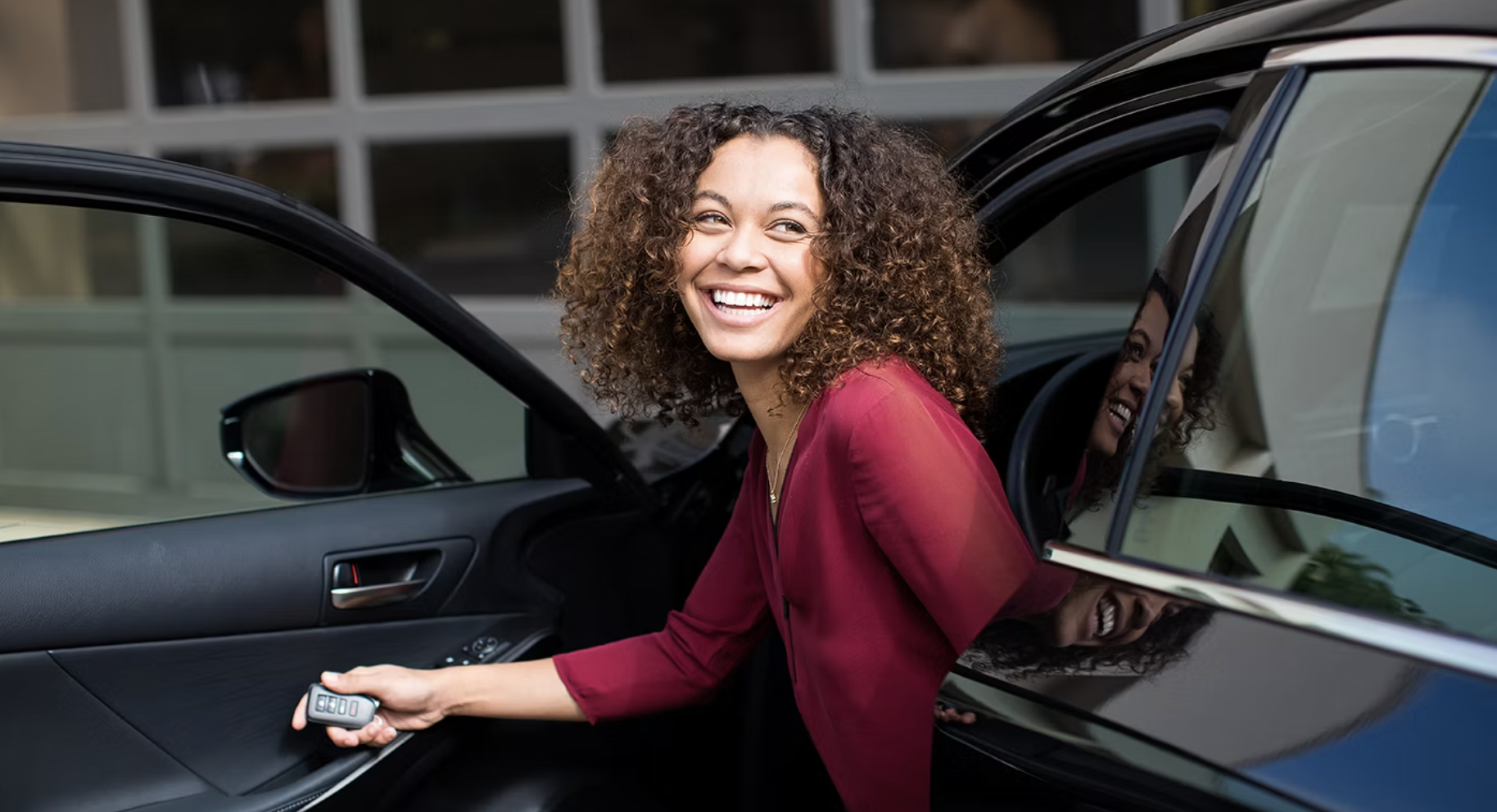 Woman dropping off her Lexus at a service center in Arlington Heights for the best oil change offer